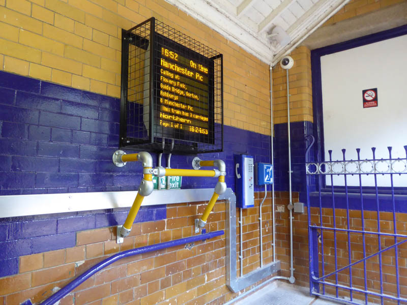 At the top of the steps to platform 1
