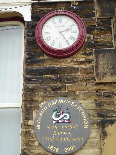 Settle clock and plaque