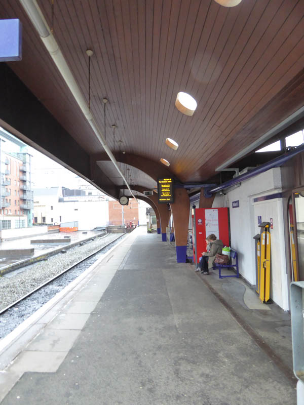 Under the wooden canopy on platform 5