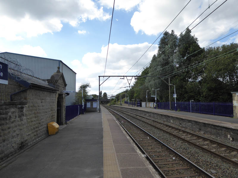 Looking west at the platforms with the steps down to the subway on the left
