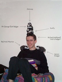 Picture: five little badgers sitting on Richard, huggin' and a-kissin'...  well, sitting there, anyway.
