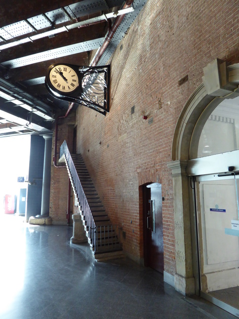 Manchester Piccadilly clock ad staircase