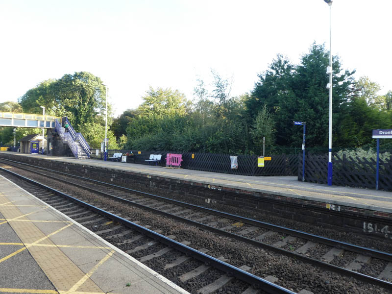 A long view of platform 2 showing the shelter, footbridge, and exit