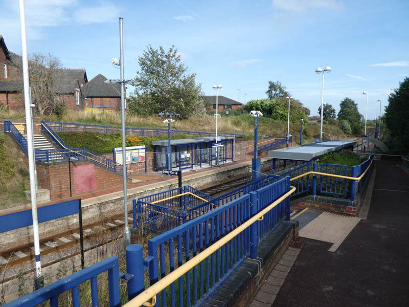Platform 1 seen from platform 2 opposite, showing the ramp and stepped entrance common to both sides