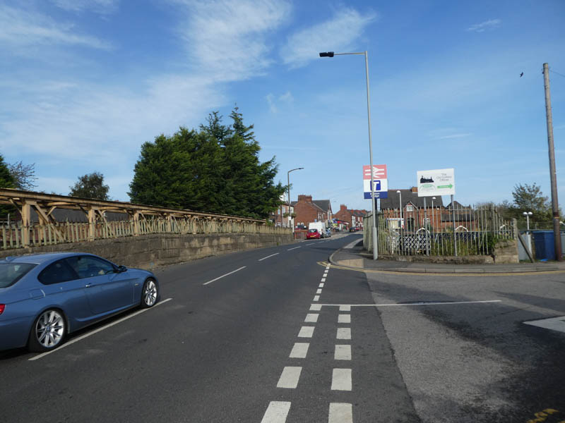 On the road bridge with the station entrance on Colliery Road to our right