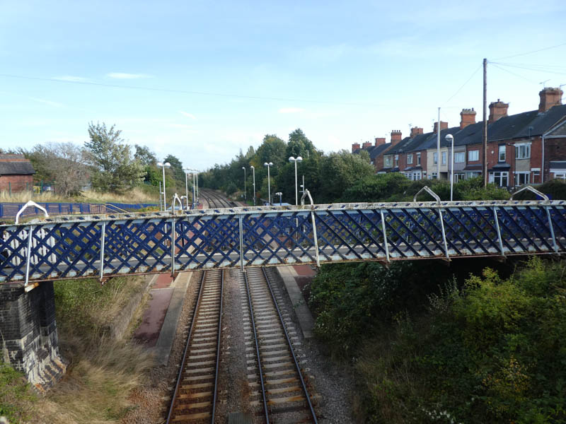 The footbridge, seen from the road bridge, with the station platforms beyond.