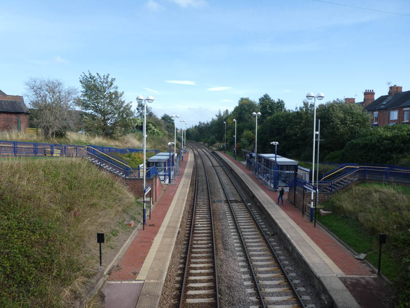 Looking east from the footbridge at the station's two platforms and shelters