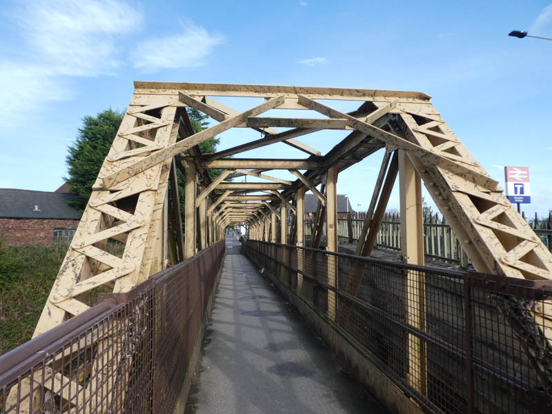 Alongside the road bridge runs a metal footbridge