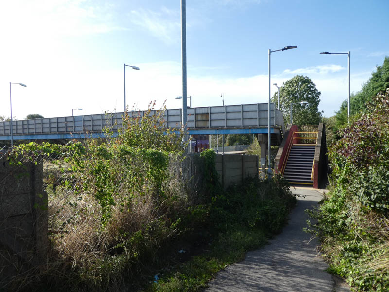 At the end of the step free path is an access to platform 1 and steps up to the footbridge