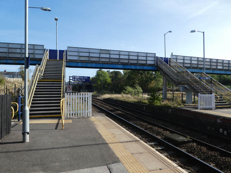 Steps lead up from platform 1 to the footbridge which provides access to platform 2