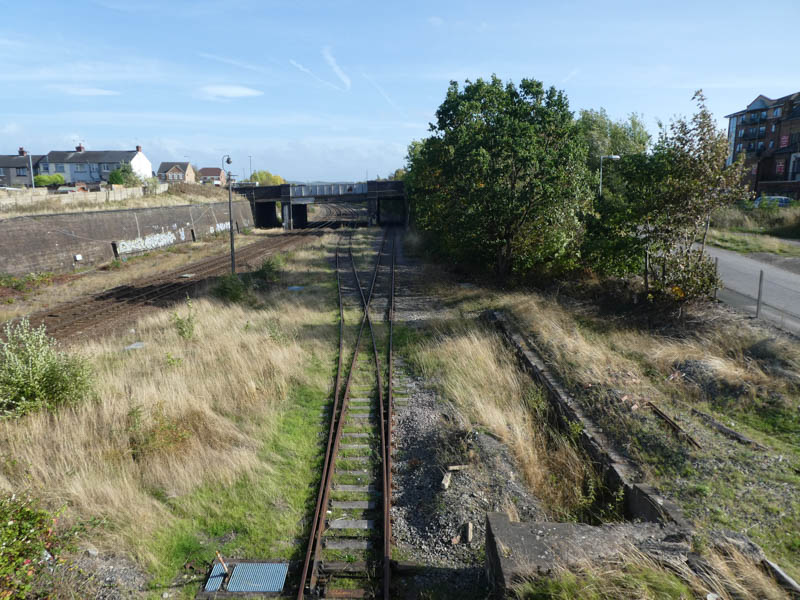 Lookinhg south from the footbridge at the course of the old rusty track