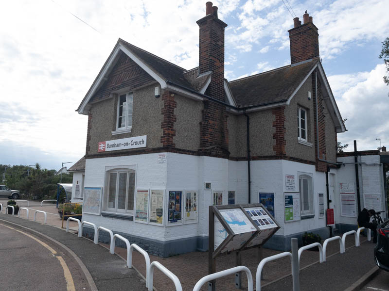 The front and side of the station building, with the entrance to the platform just to the right