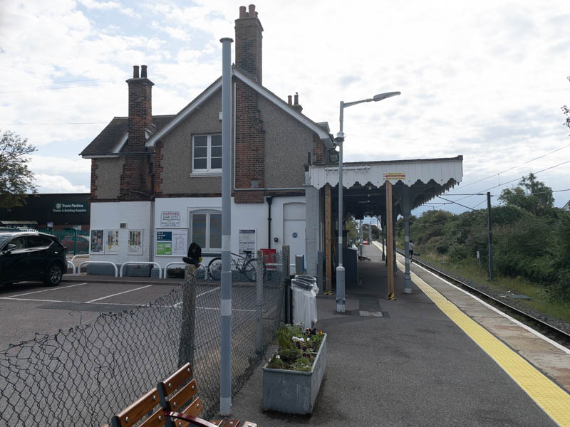 On the platform looking south at the side of the building and the canopy, apparently propped up with bits of wood.