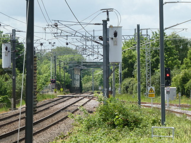 Cambridge North looking south at level crossing and bridge