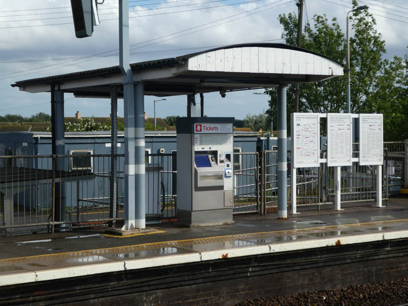 The ticket machine on platform 1 has an old style wooden shelter