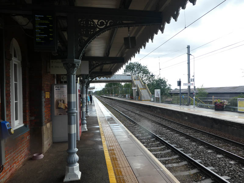 Under the canopy on platform 1 sheltering from the rain