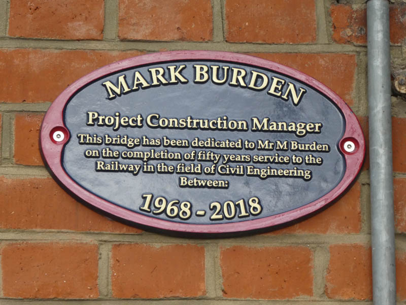 A plaque on the bridge to Mark Burden, Project Construction Manager.  This bridge has been dedicated to Mr M Burden on the completion of fifty years serivce to the Railway in the field of Civil Engineering Between: 1968-2018