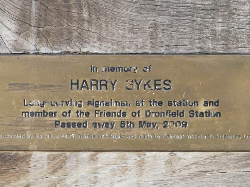 A plaque In memory of HARRY SYKES, Long-serving signalman at the station and member of the Friends of Dronfield Station, who passed away 5th May, 2009.