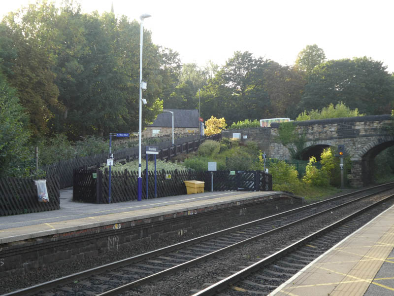 The western end of platform 2 has a ramp up to the road bridge over the line, and thence to platform 1.