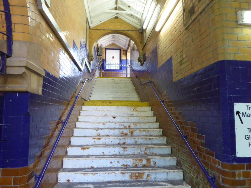 Steps lead up to platform 1 from one end of the subway