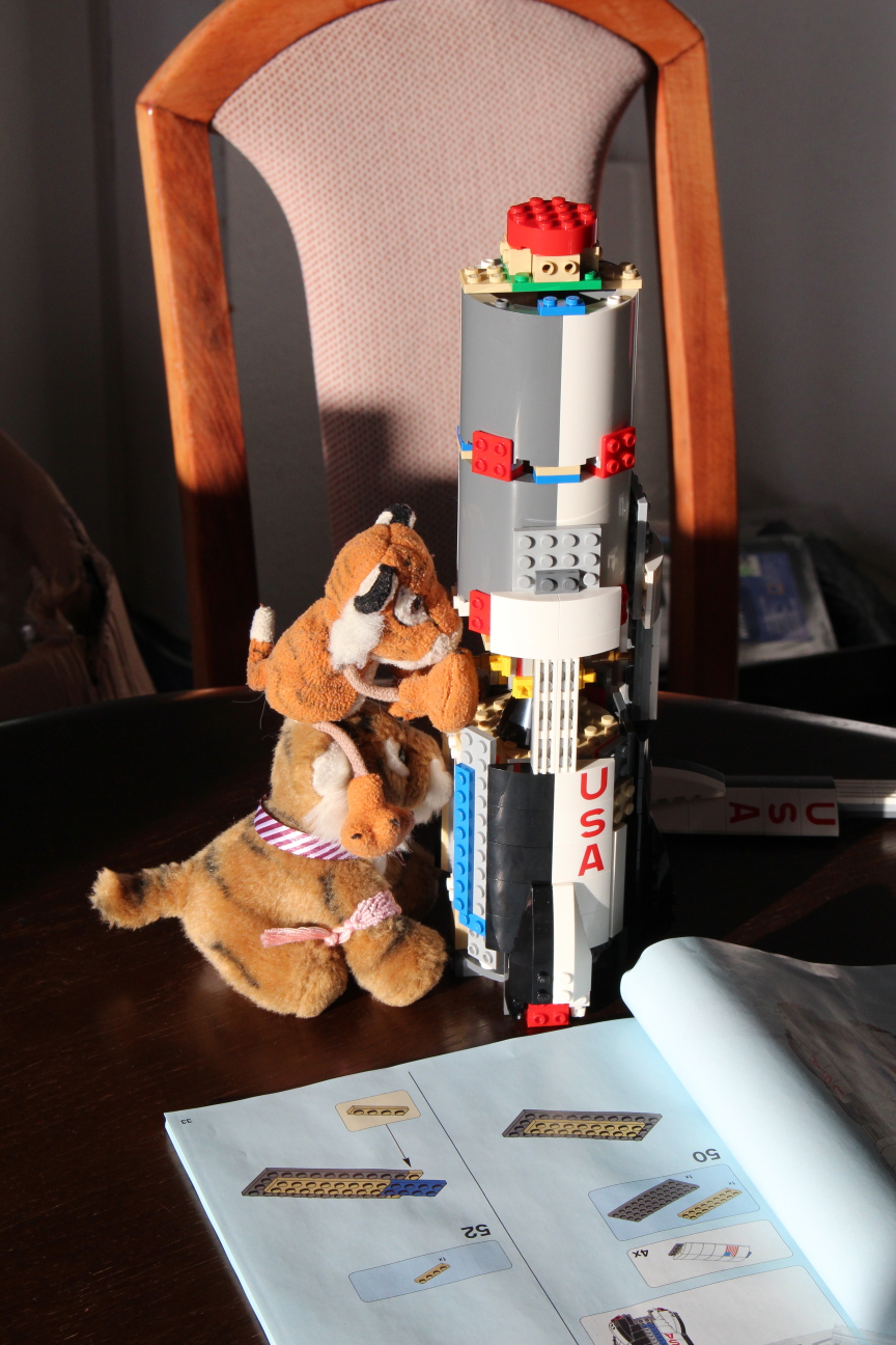 Pico and Sam ensure the correct alignment of parts within the partly-assembled first stage