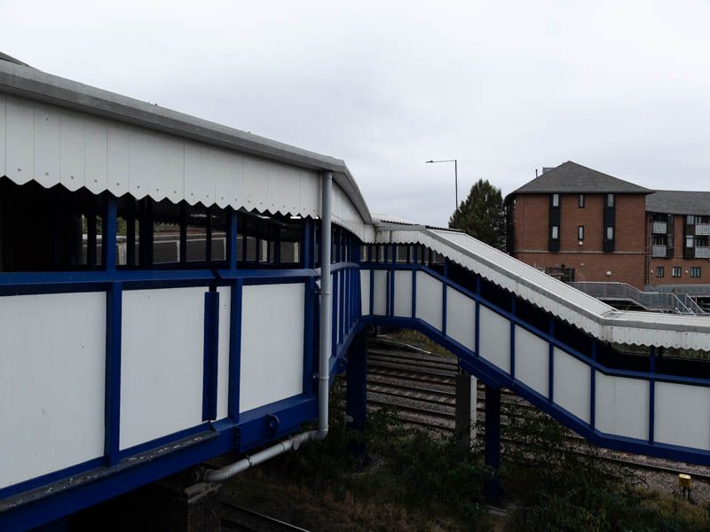 The footbridge seen from the platform 2 steps leading up to it